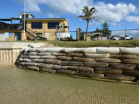 Giant sangbags line the shoreline in the northern New South Wales town of Kingscliff, Tuesday, June 5, 2012. The foreshore which has been progressively eroding has been sandbagged as a last defence to the local Tourist Park and Surf Life Saving Club. (AAP Image/Dave Hunt) NO ARCHIVING