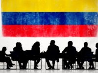 Business People in a Meeting with Colombian Flag